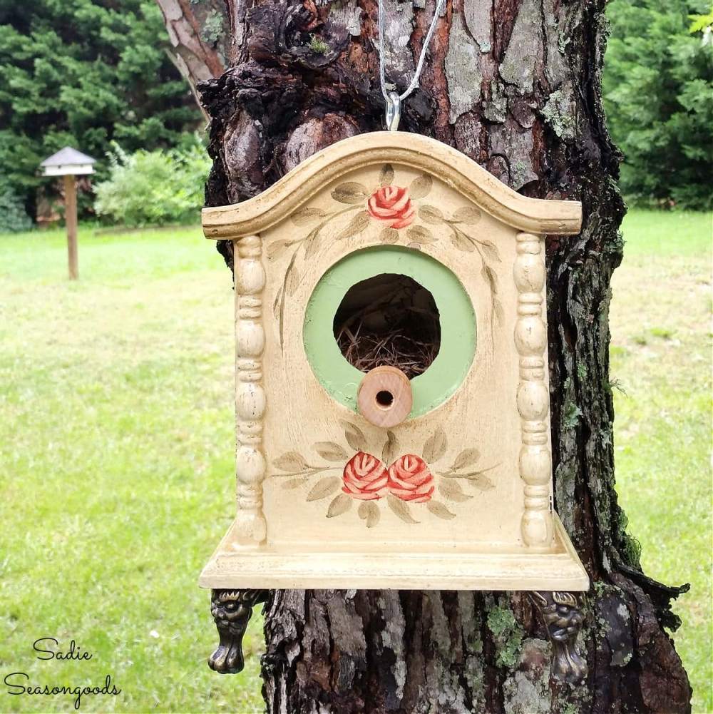 A birdhouse made from an old clock