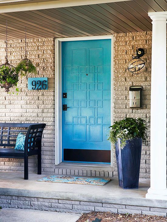 Hanging and potting flowers blue door