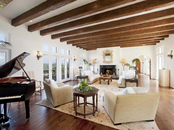 Example of a tuscan living room design in Boise with beige walls