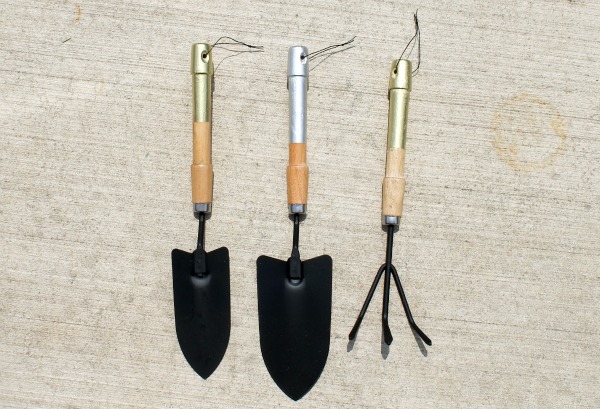 silver and gold garden tools