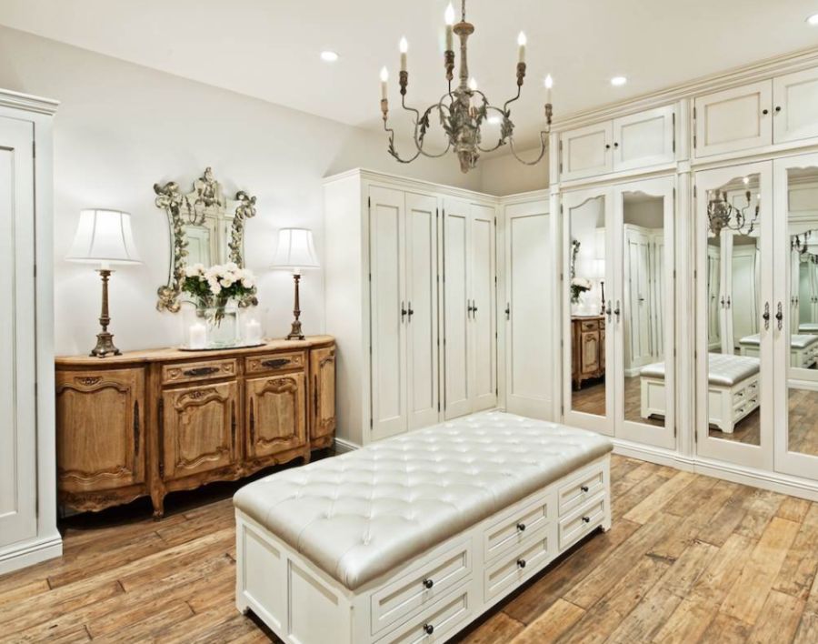 Example of a large transitional gender neutral carpeted dressing room design