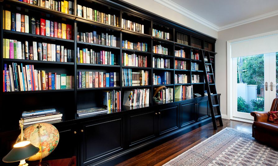 Library room with ladder for upper storage