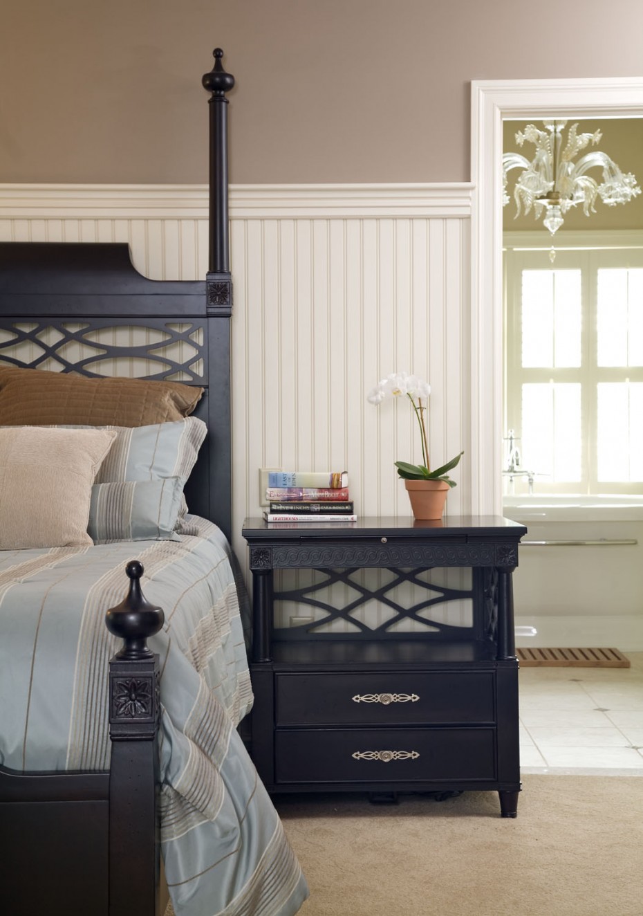 Master bedroom white beadboard and black furniture