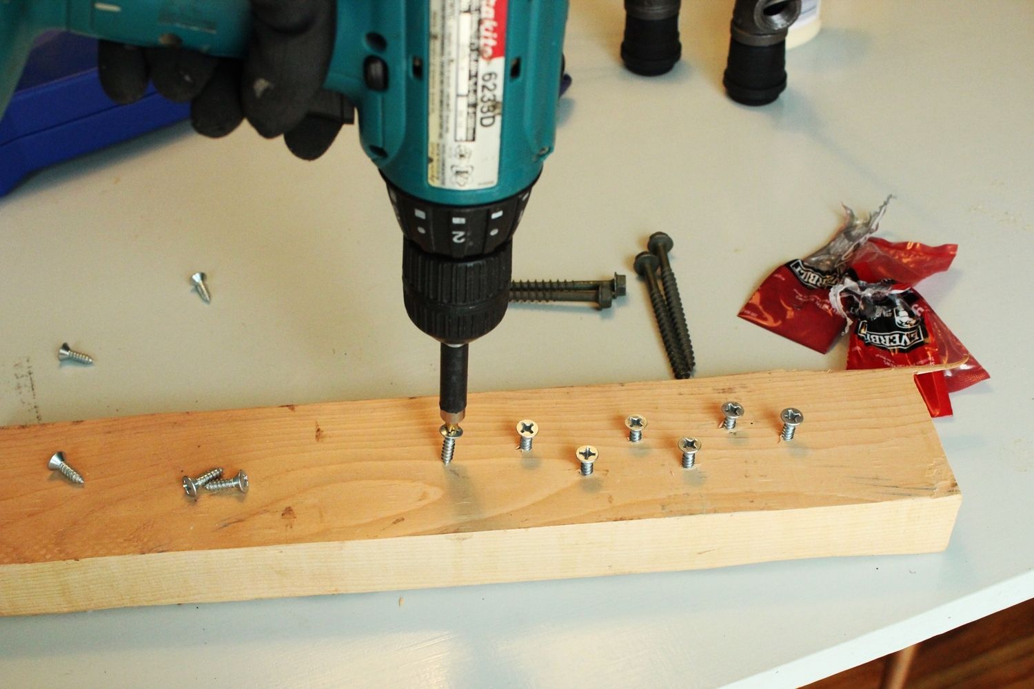 Diy industrial bathroom light featuring edison bulbs