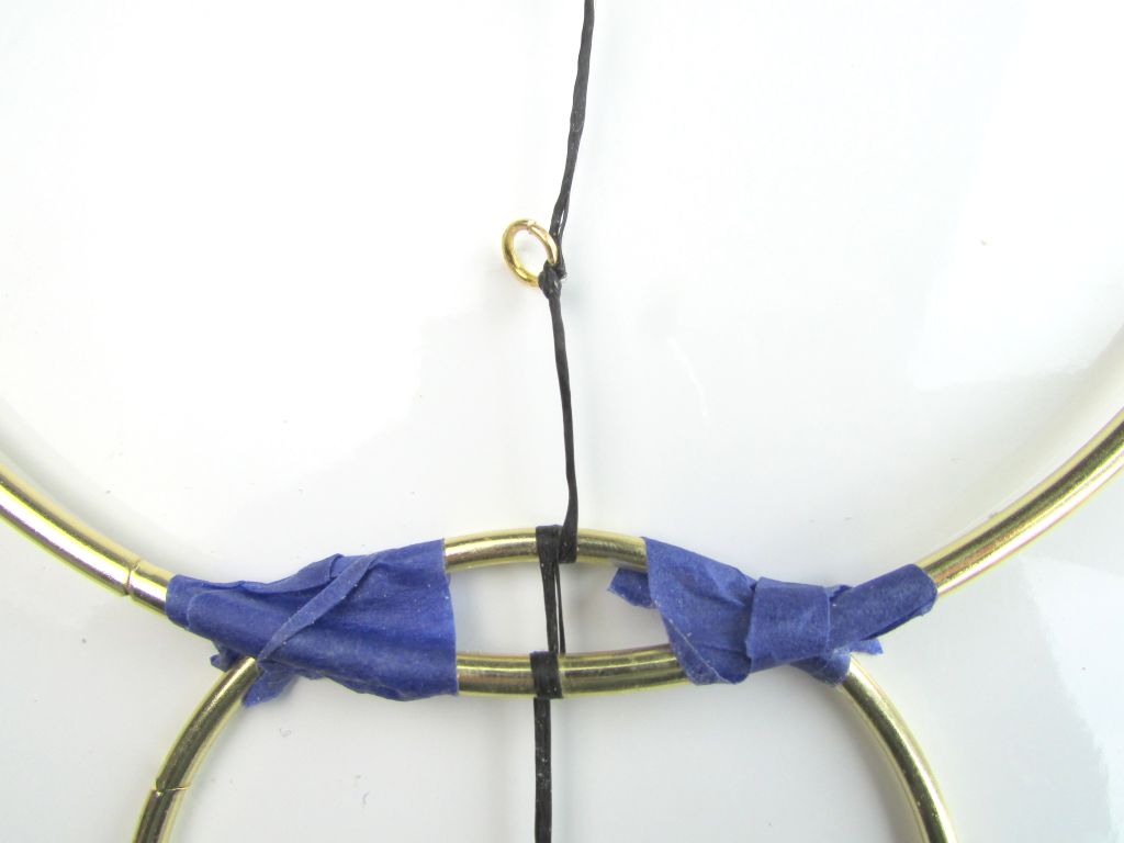 Wood beads and brass wall hanging 1