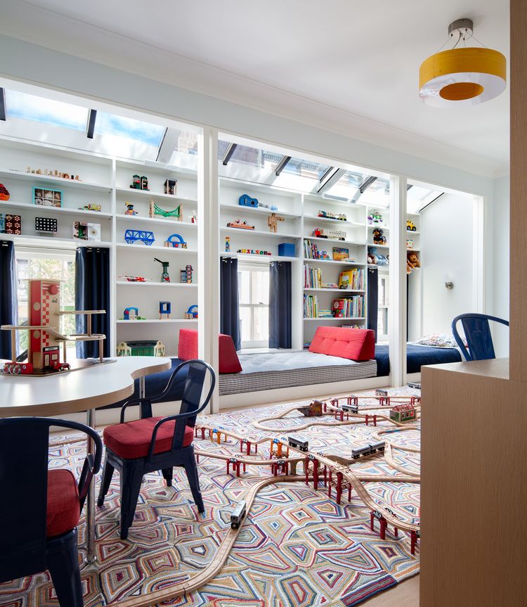 This playroom has more than enough space for imaginative play. The amusing rug is yet another example of how Henderson designs child-centered spaces that are fun but not juvenile.