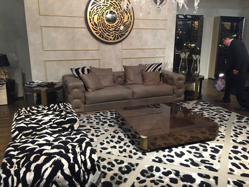 Whatever you choose to call it, this is a stunning example of a formal space entertaining space. The bold animal prints, combines with a lacquer table and luxe leather sofa some together in one unique room. It's also a good lesson in how art can elevate the look of a space.