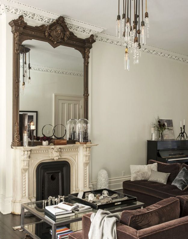 Framed mirror above fireplace