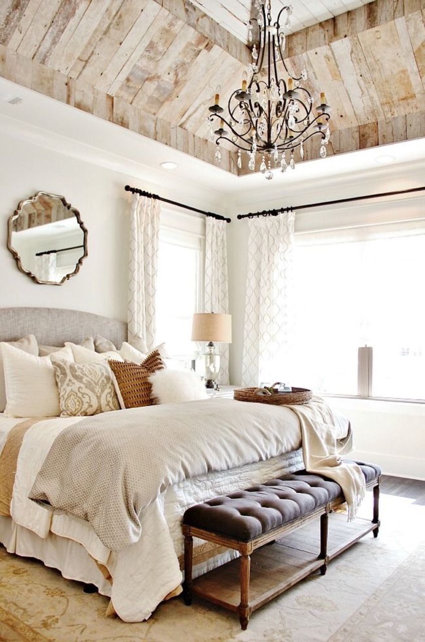 Premium Photo  A bedroom with a large chandelier hanging from the