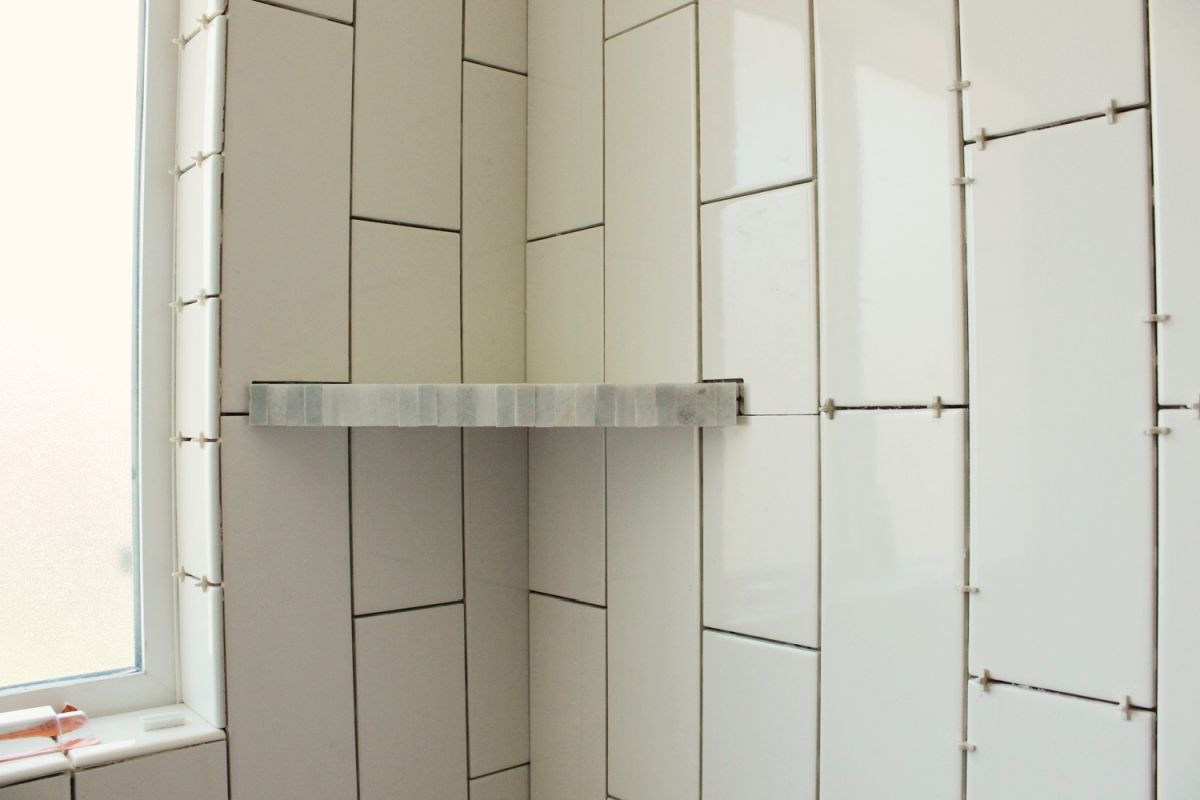 Install a Corner Shower Shelf With Tiles