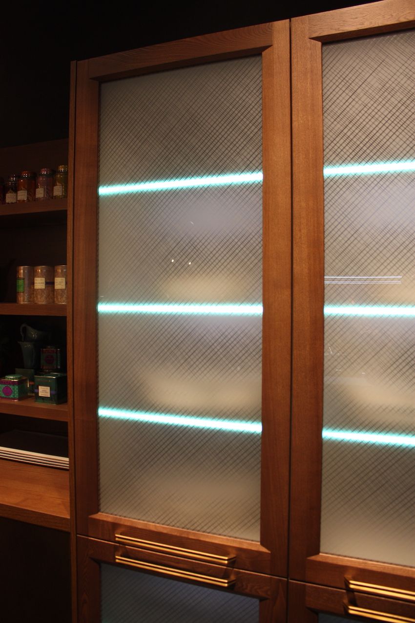 These wood kitchen cabinets from Febal Casa have frosted glass doors that give you a glimpse of the LED lights edging the glass shelves inside. It's yet another example of using wood in conjunctions with the latest kitchen innovations.