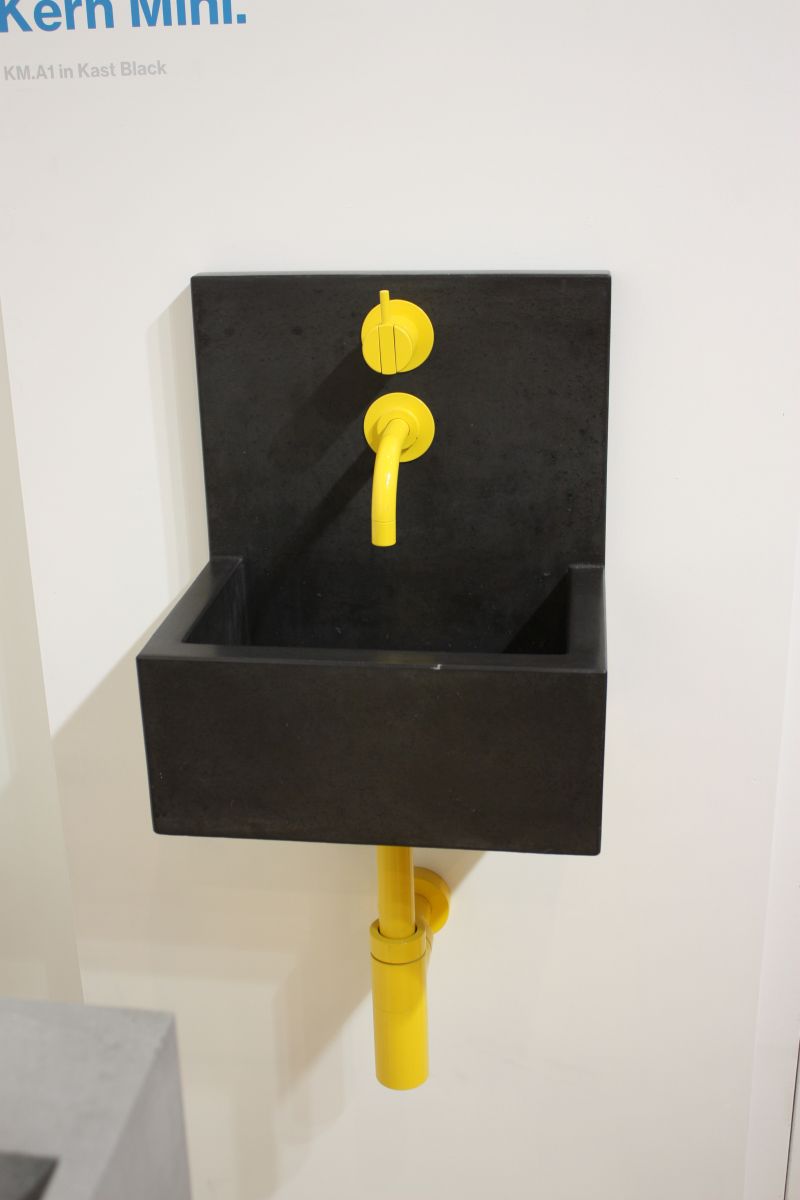 Kast black bathroom sink with yellow faucet