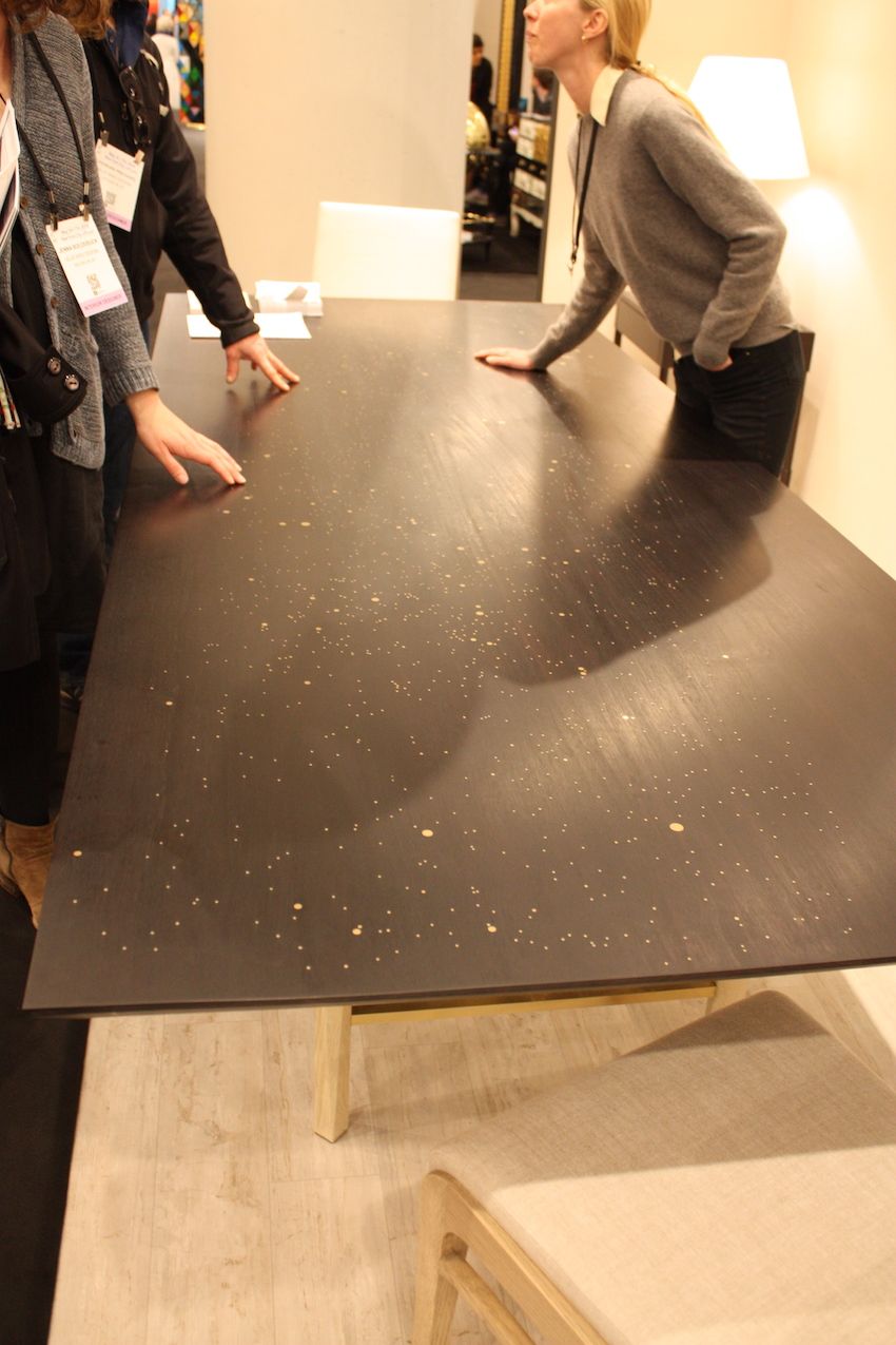 We first thought that the shrinking of round metal inlays in this gorgeous table by Asher Israelow was just that -- a random sprinkling. Come to find out that the varied dots of metal are actually representations of a star map, which only makes the work more spectacular. Israel's tables are star maps of specific dates and this one is of the night sky on the date that Albert Einstein discovered his theory of relativity.