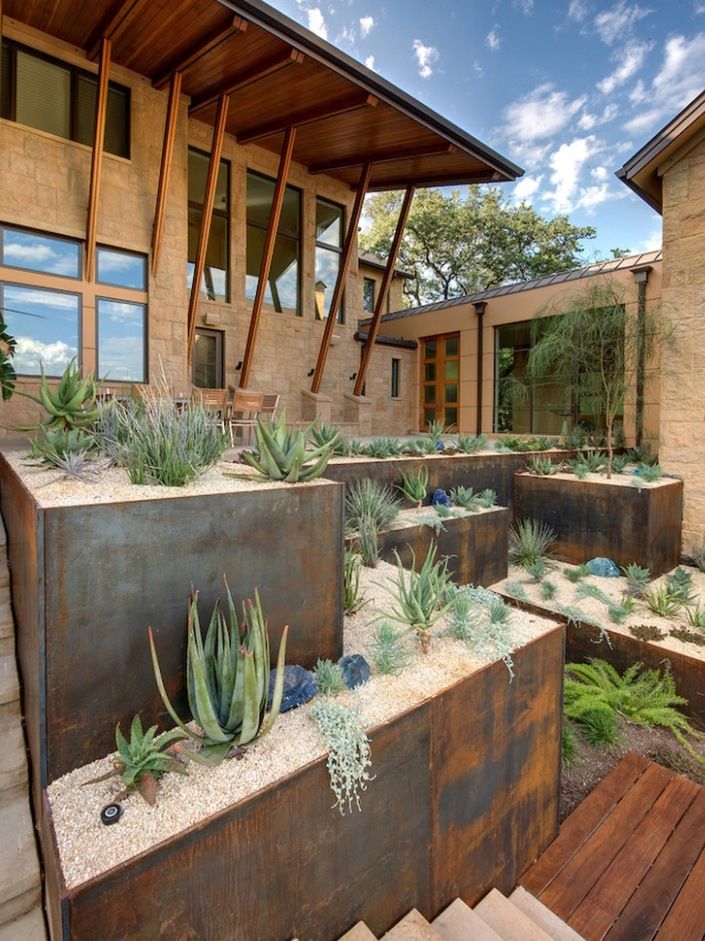 Large metal containers can be used to create a terraced garden