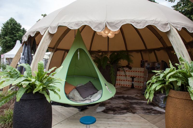 Outdoor living tent with a small hanging chair