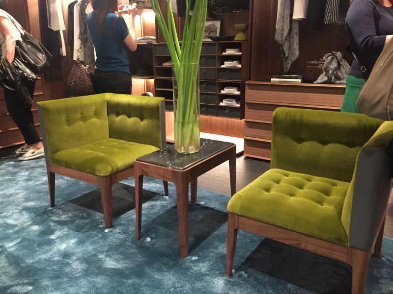 Green symmetryc chairs with a blue shade carpet