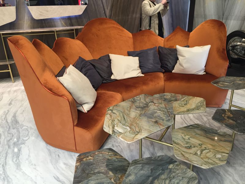 https://cdn.homedit.com/wp-content/uploads/2016/09/Unique-curved-sofa-decorated-with-throw-pillows.jpg