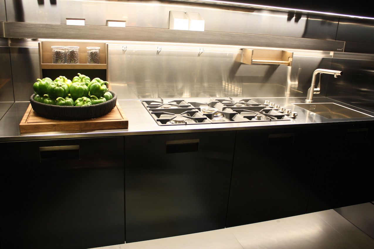 Arclinea's counter with cooktop and sink has lots of functional extras.