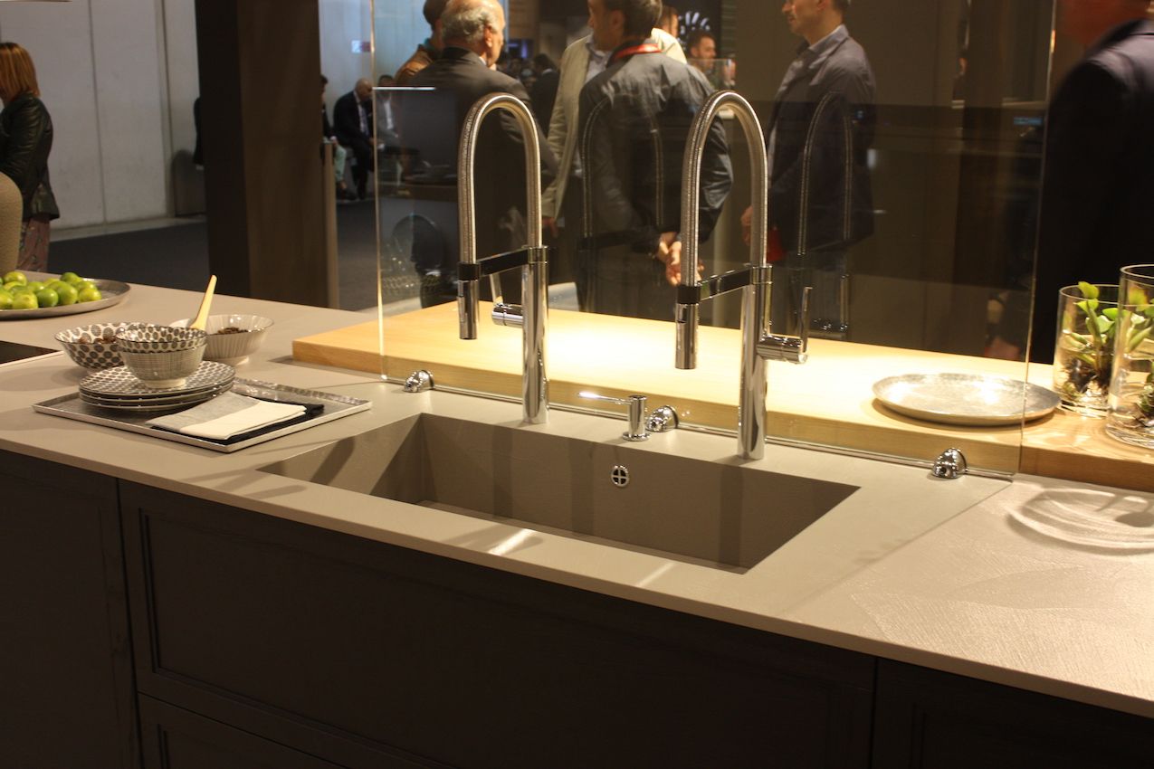 Arrex shows a large single sink with two upper neck faucets.