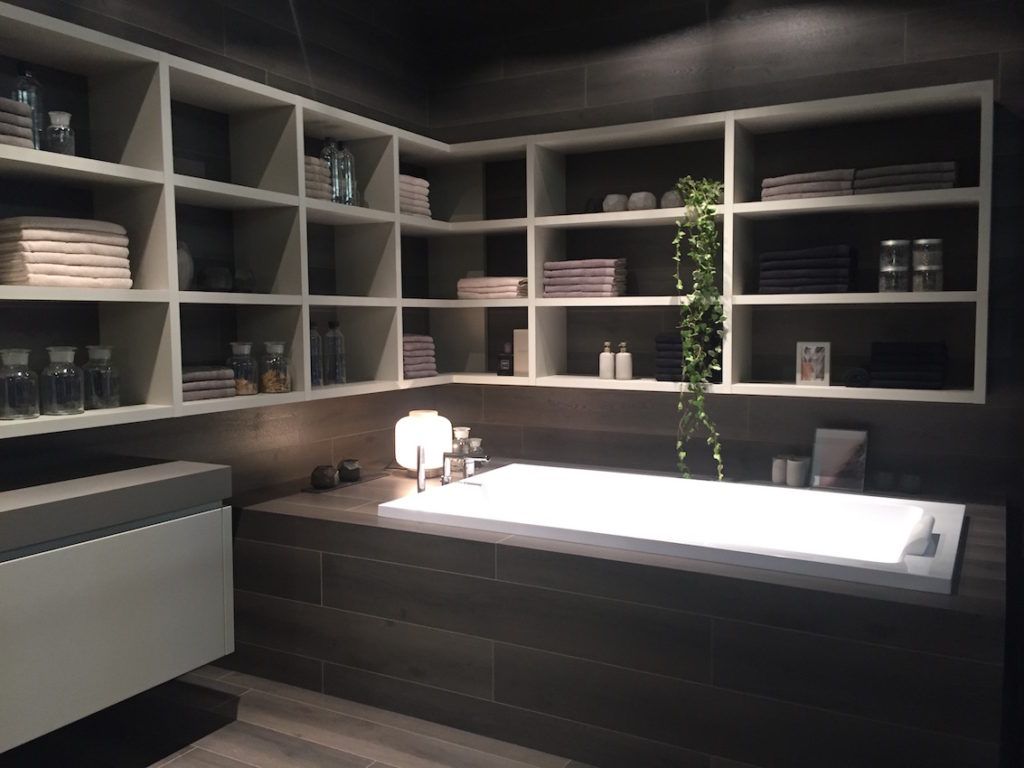 Open shelving above the tub makes the most of a bathroom corner.