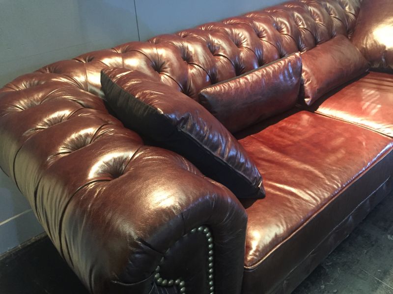 Brown leather tufted sofa couch