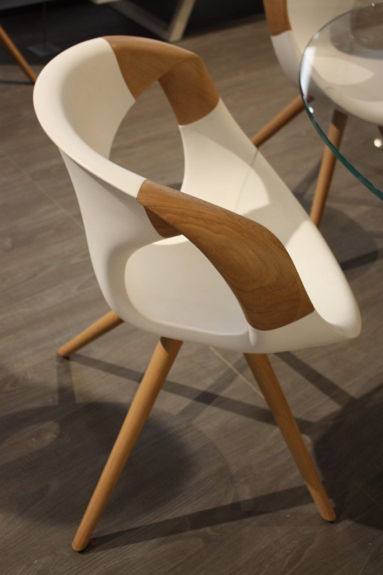 A cleaner, more modern design can still have an unexpected feature, like the arms on this chair from Tonon.