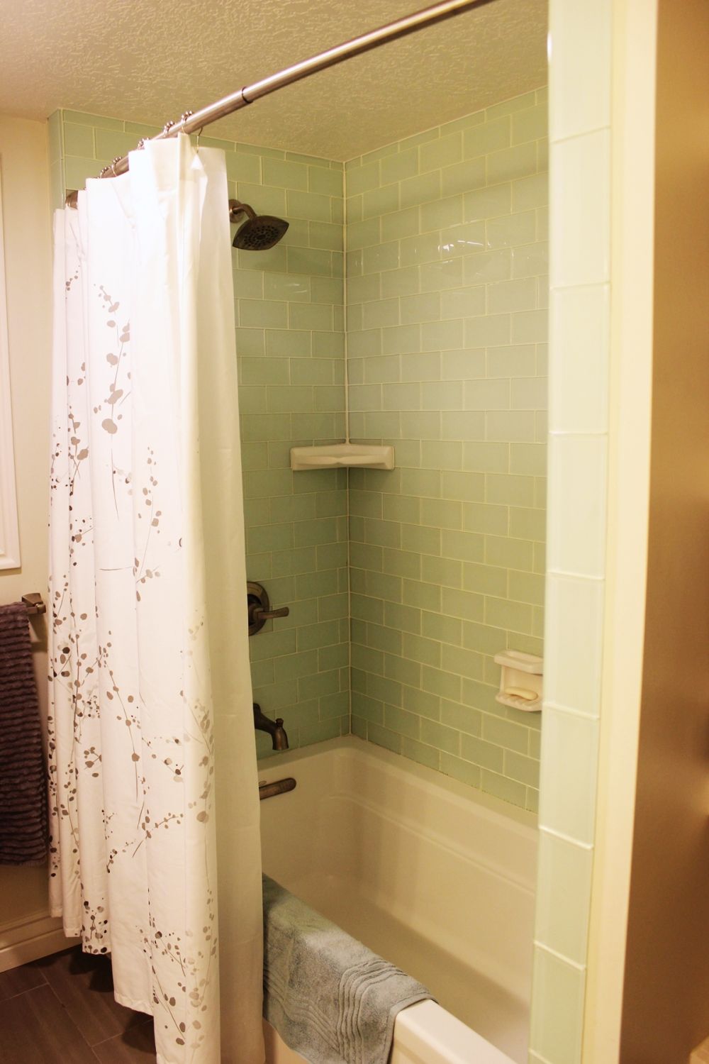 bathtub surround in beautiful aqua glass tile