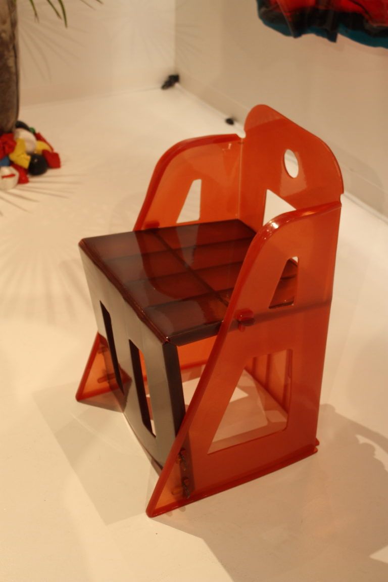 Two colors of acrylic accent the angular shape of the seat.