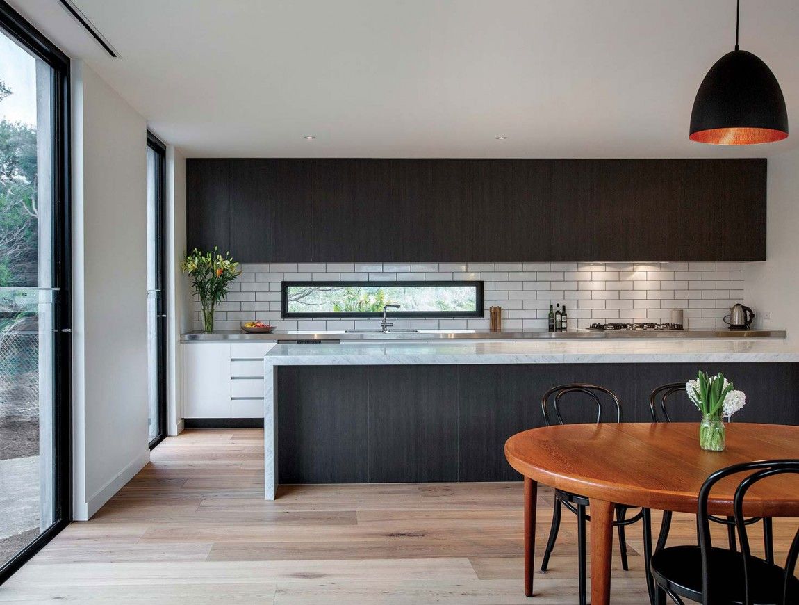 Open space kitchen with a letterbox window above countertop