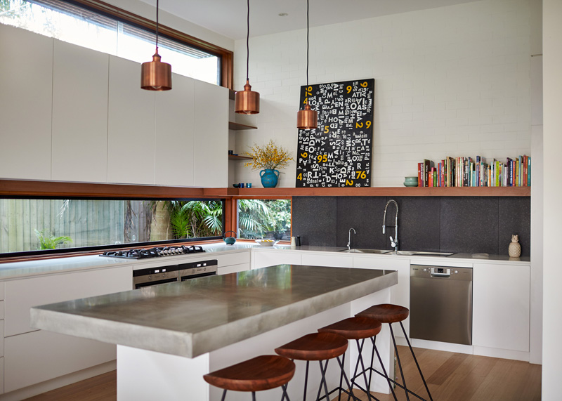 Open space kitchen with a letterbox window above countertop