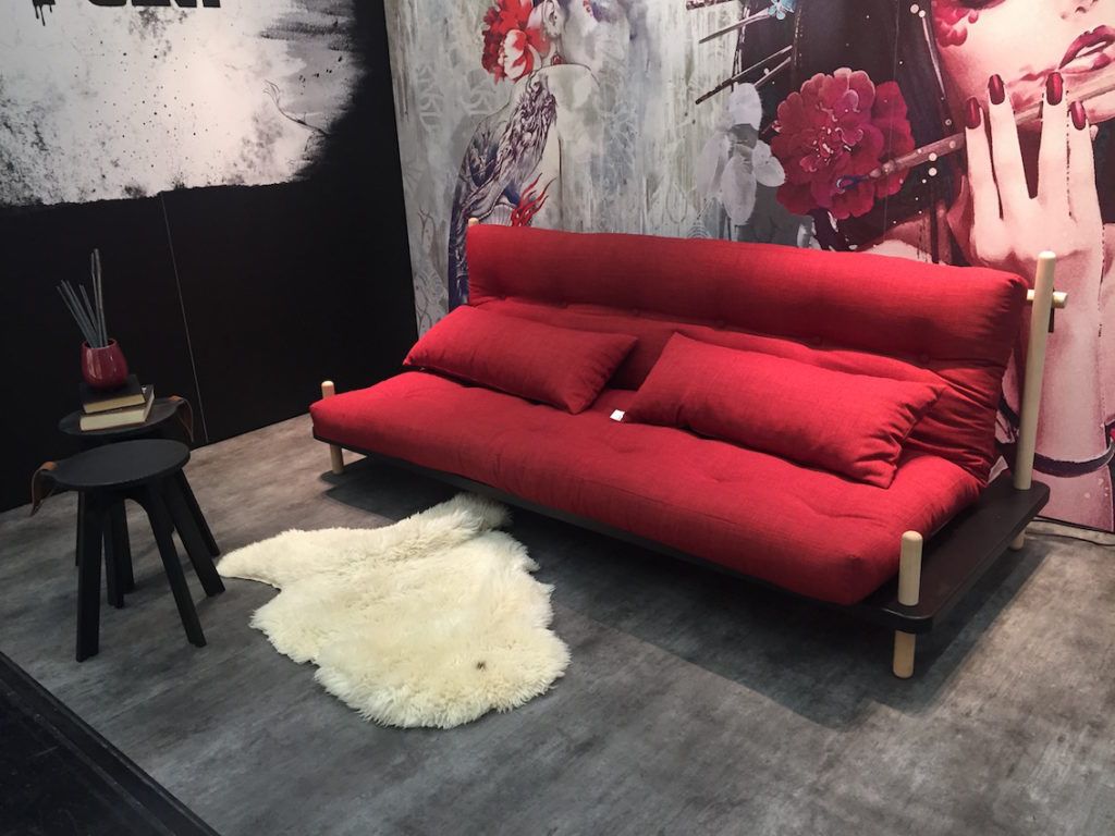 A red futon for your living room or spare room.