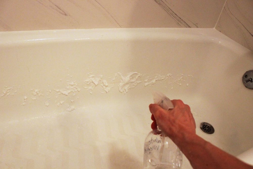 spray white vinegar onto baking soda paste