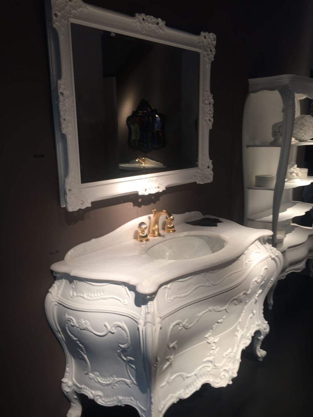 White victoran bathroom vanity and framed mirror