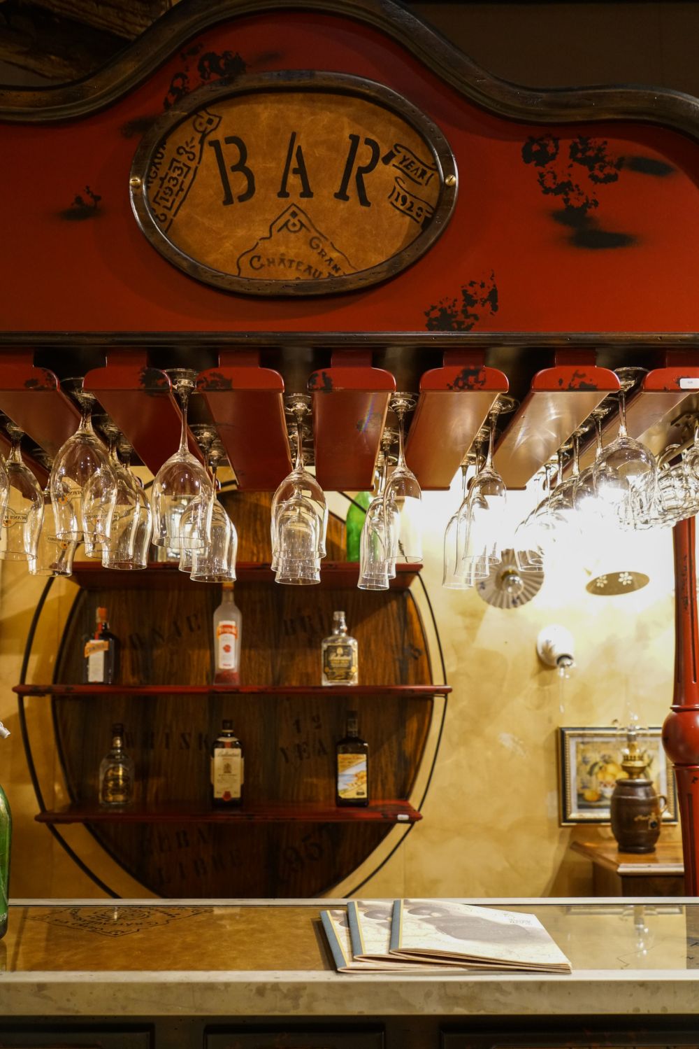 Osteria red and wine machine featuring two small barrels