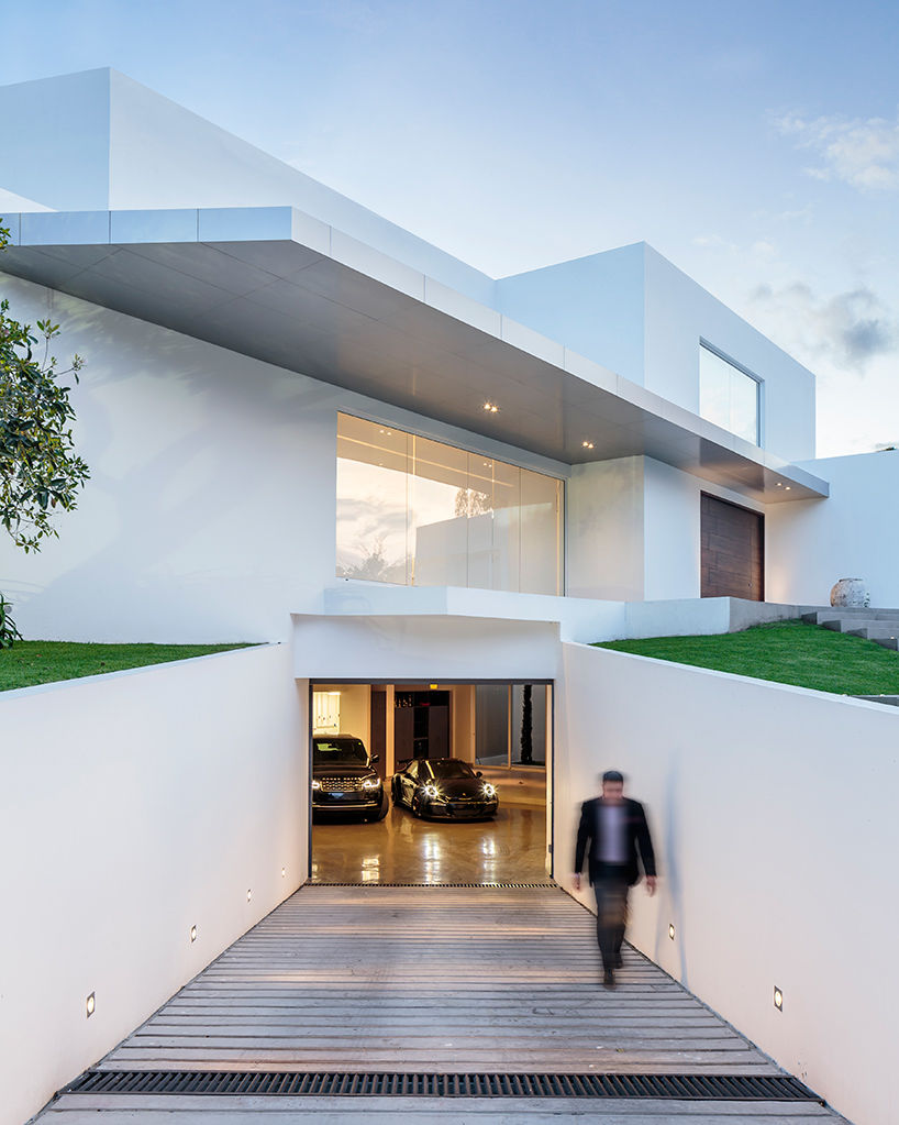 Box like house with a small car garage