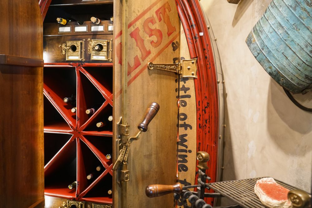 Osteria red and wine machine featuring two small barrels