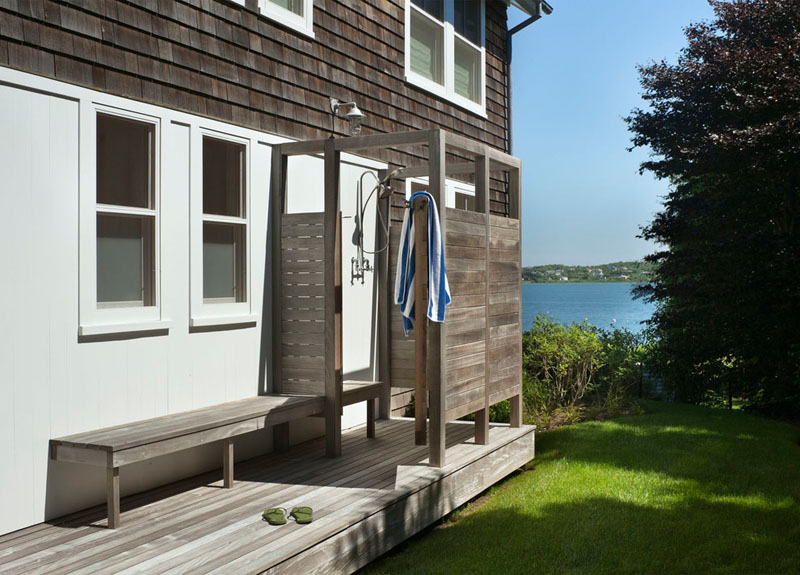 Narrow outdoor shower design concrete walls and copper plumbing