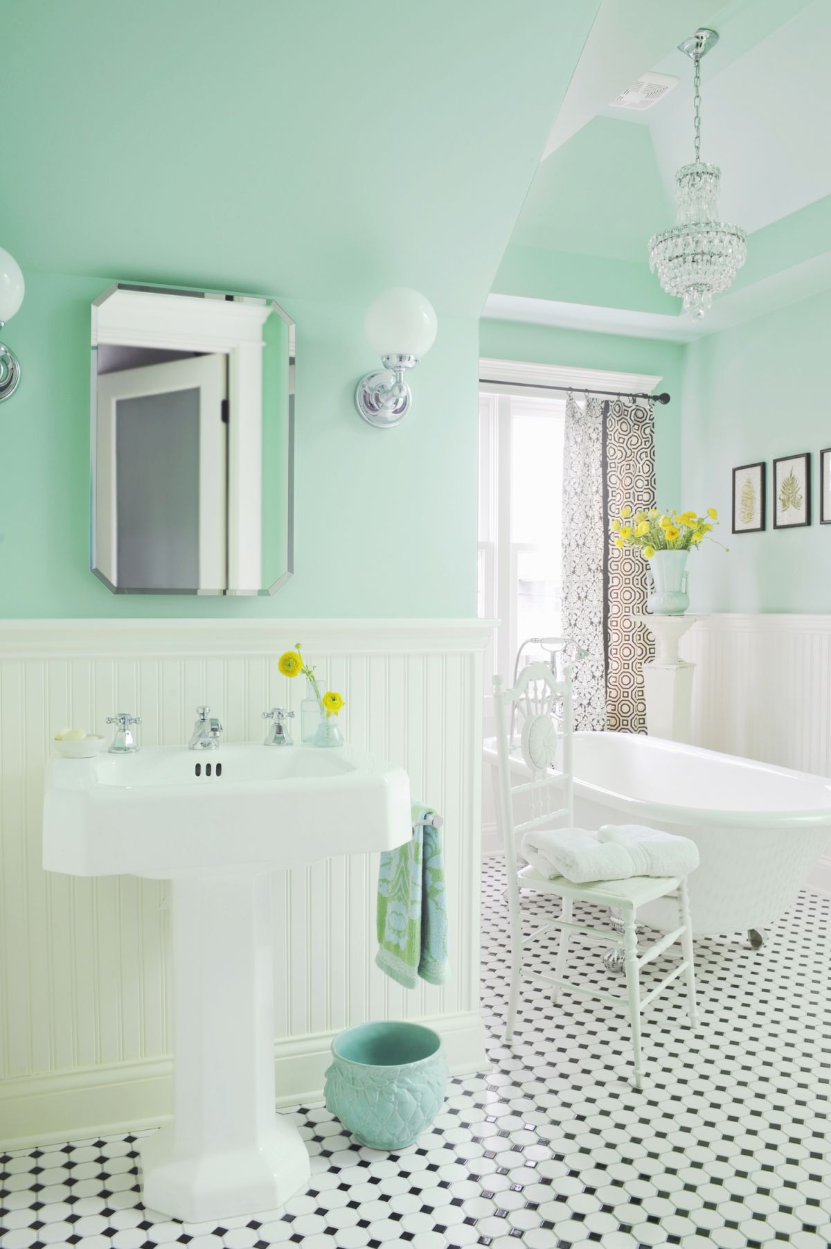 Mint green landry room with gray tiny tiles for backsplash