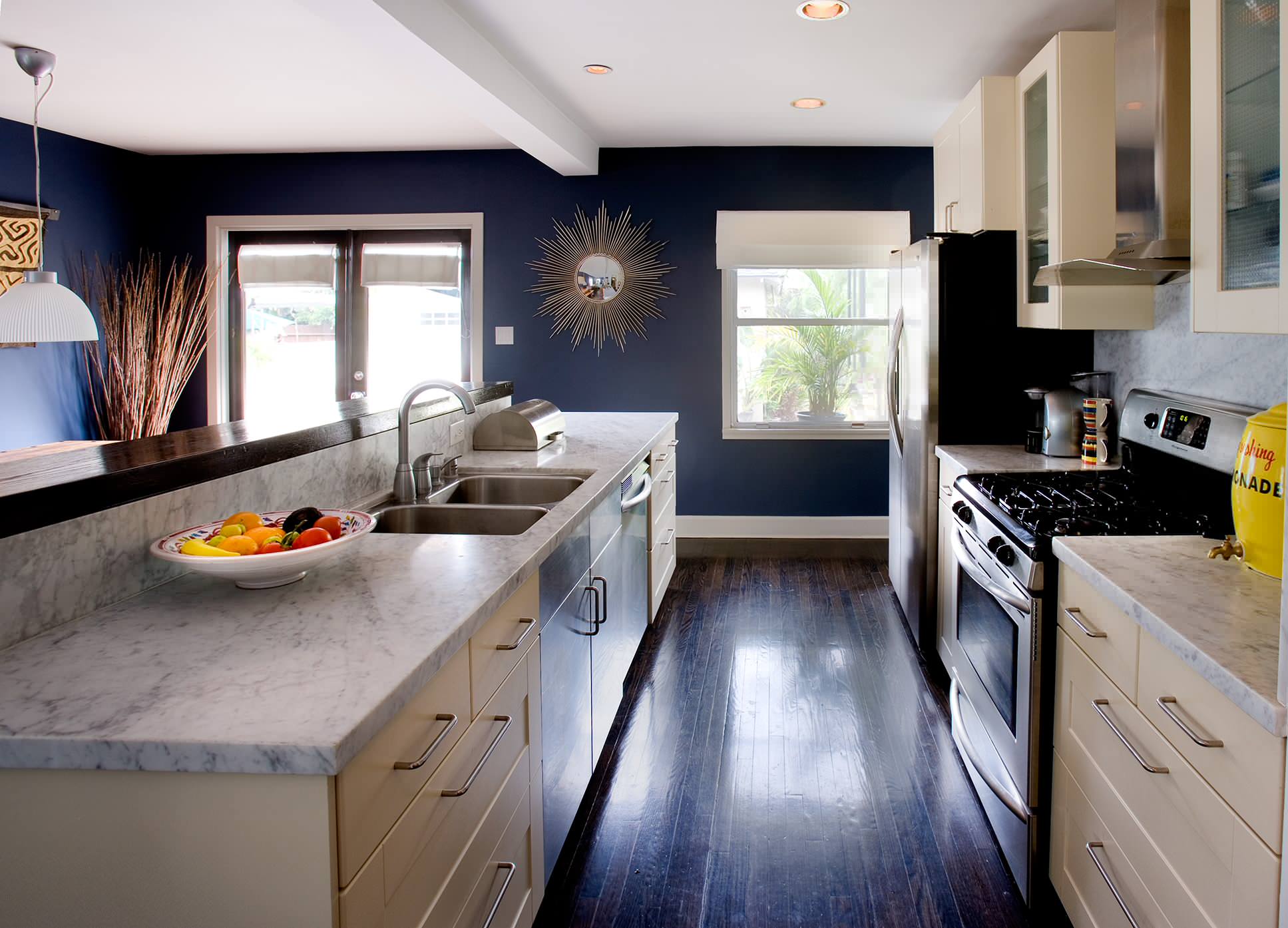 Navy kitchen wood floor large windows