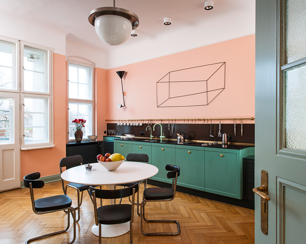 Pink kitchen wood floor green cabinets