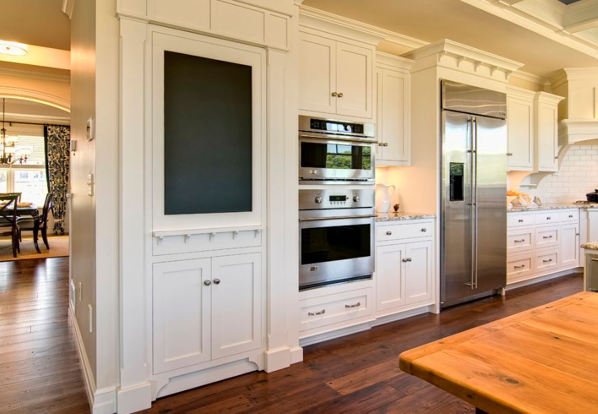 Traditional kitchen design with chalkboard paint door