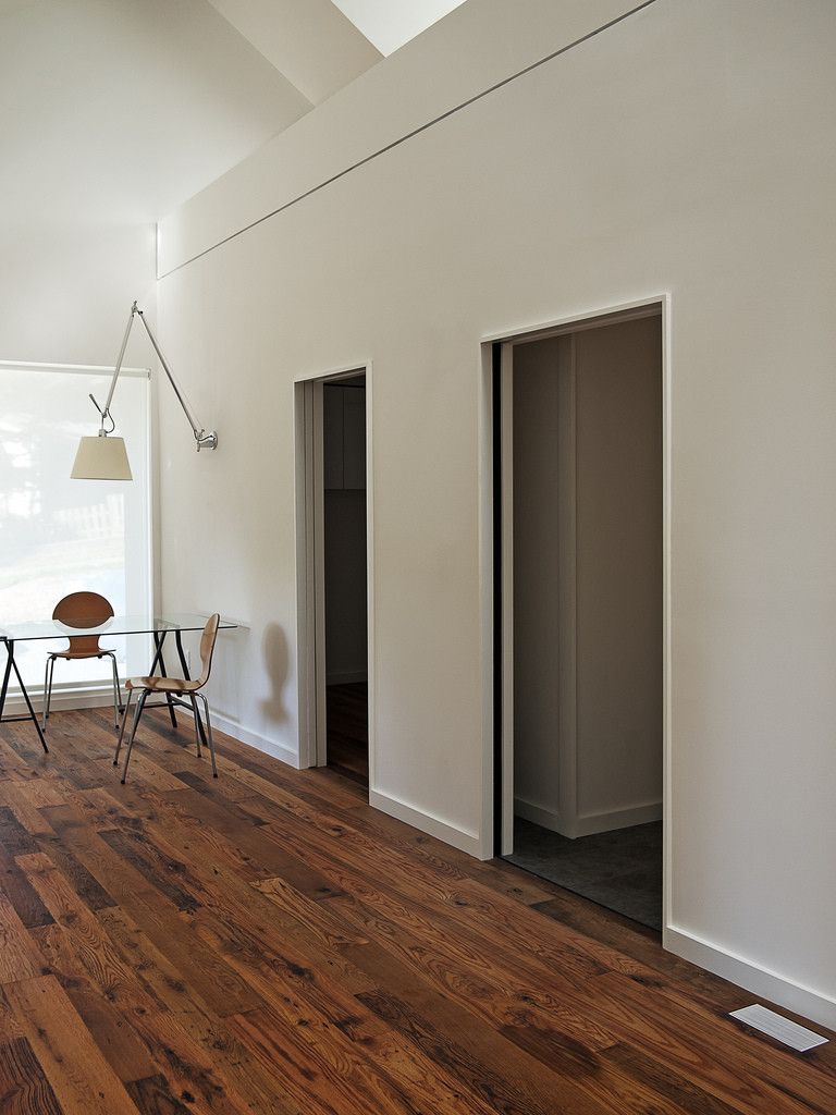 Kitchen with small kitchen that feature a wine fridge and floor from cork