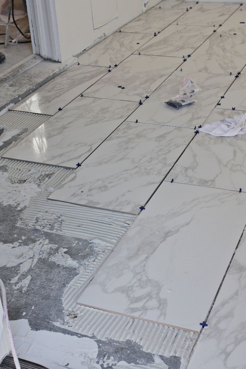 Guide to tile a bathroom floor with marble tiles