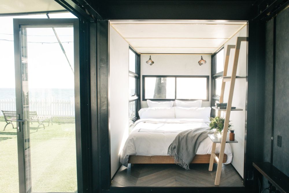 eco-chic shipping container flophouze hotel with small porch