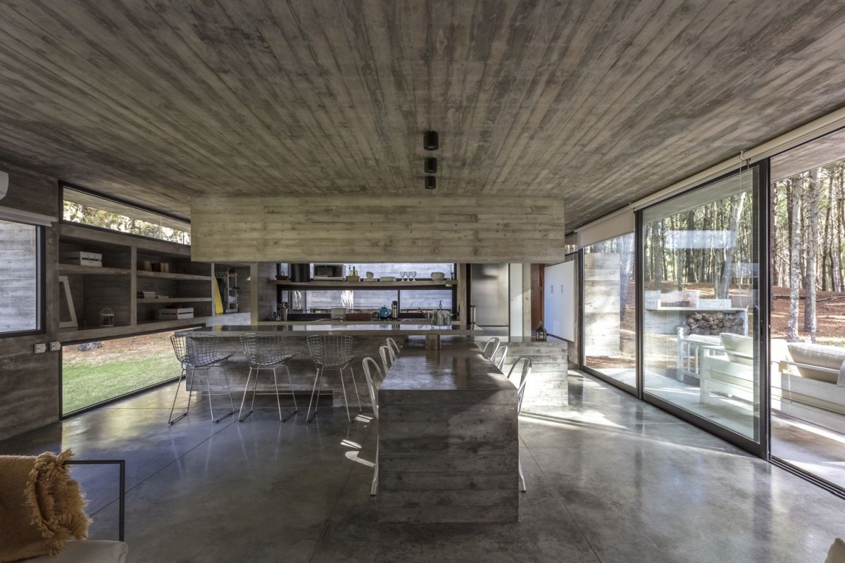 Polished concrete floors visually connect the spaces and also help to maintain simplicity throughout the house
