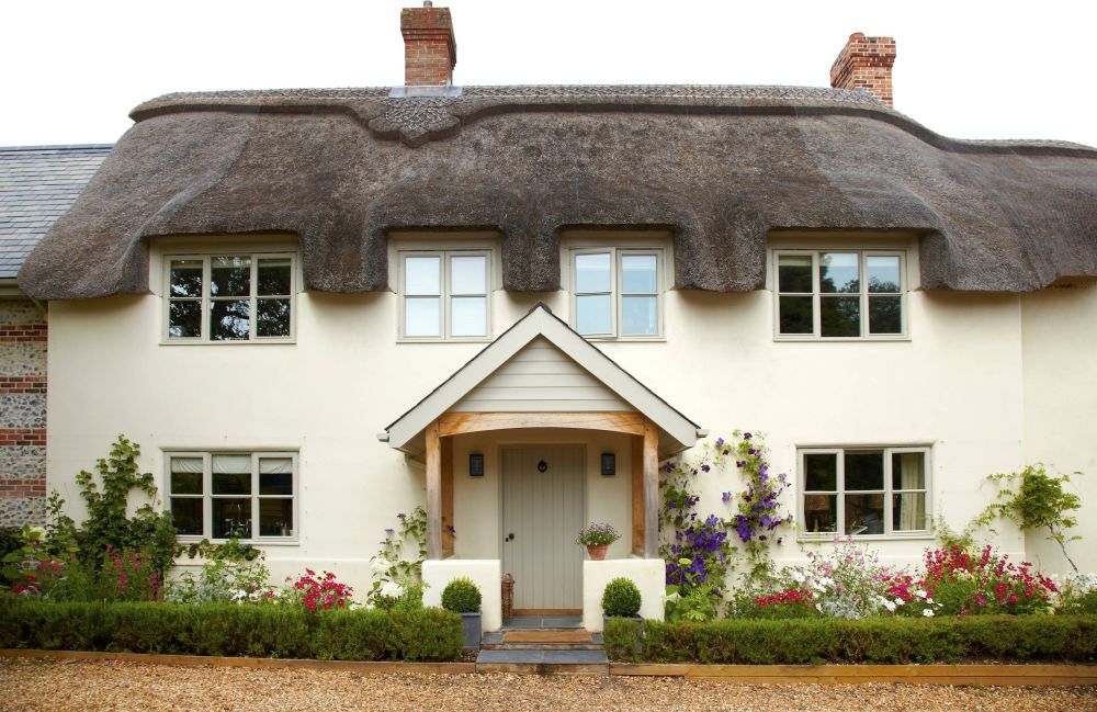 Tthatched roof Cottage Style Home