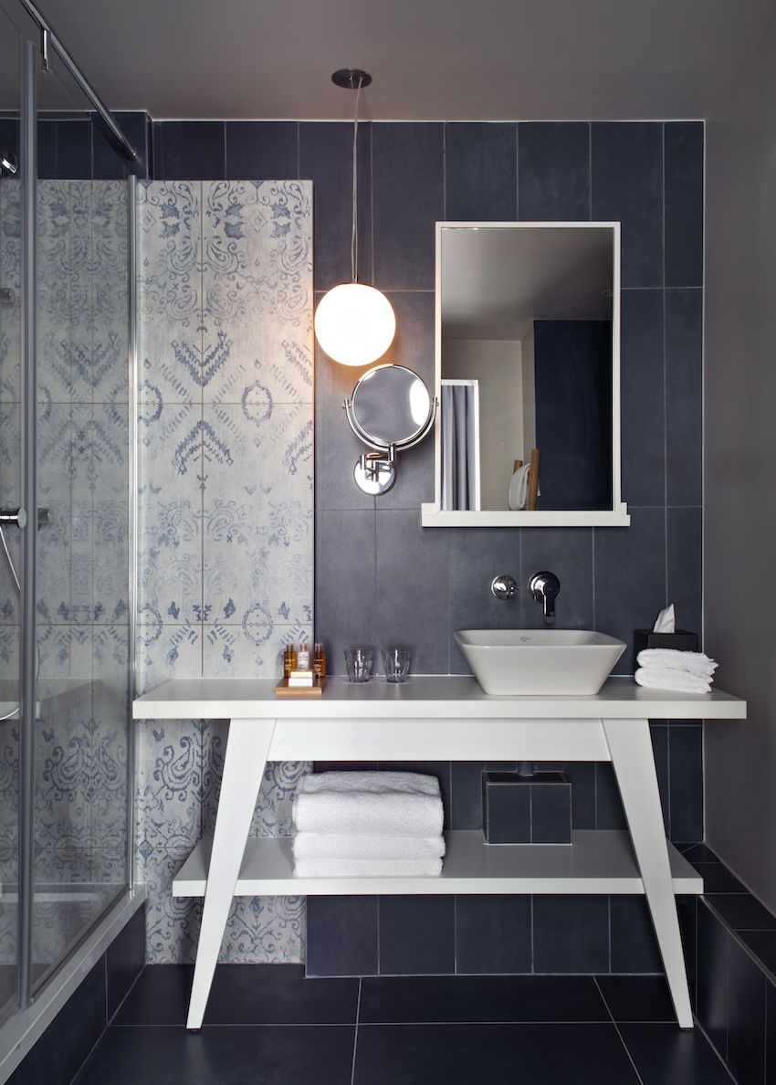 Bathrooms have a tranquil color scheme and stylish elements.