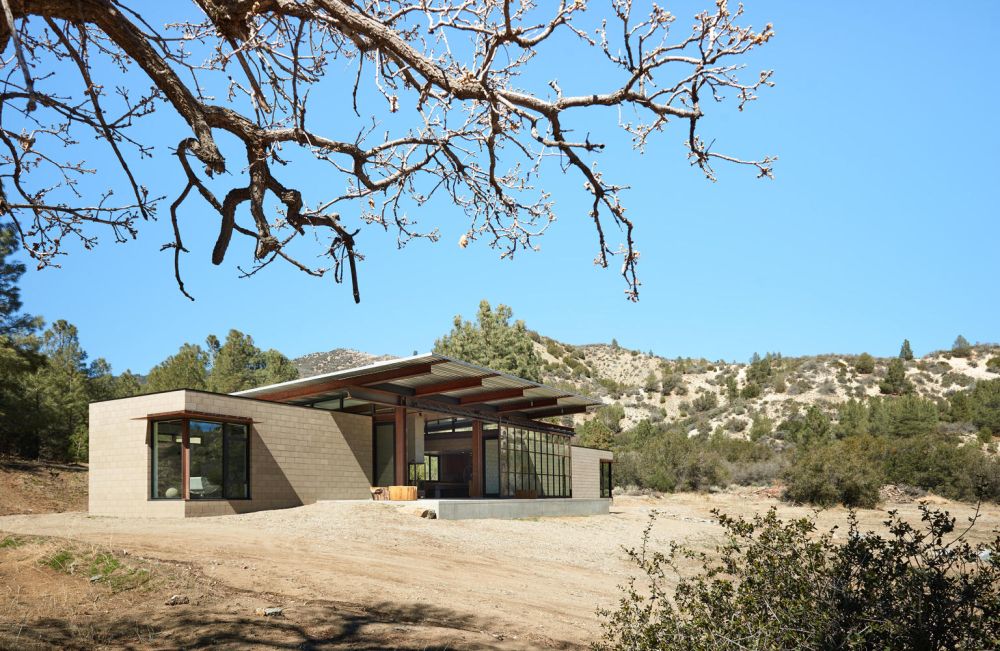 The desert landscape and harsh climate inspired the architects to use durable materials throughout the project