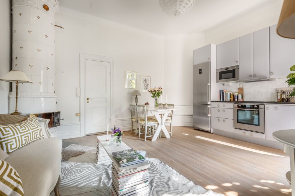 Open space living room in Sweden with corner fireplace