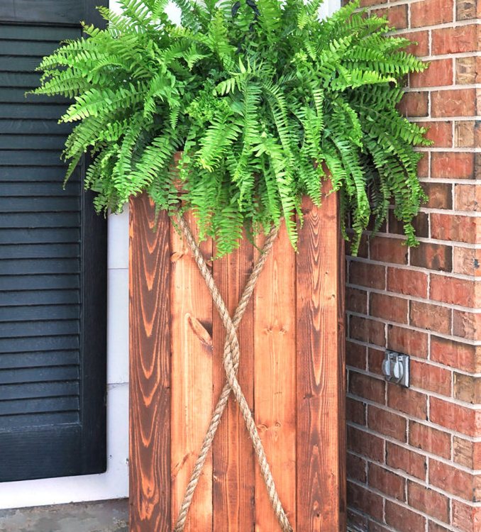 Entryway diy wood project with rope and green plants